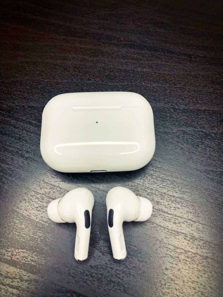 AirPods Pros outside of the charging cases
