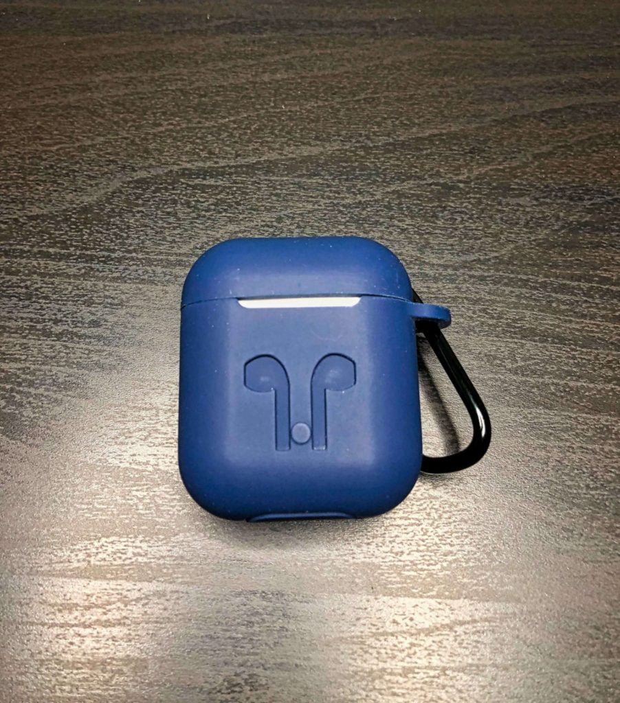 AirPods in a blue silicone case with the lid closed