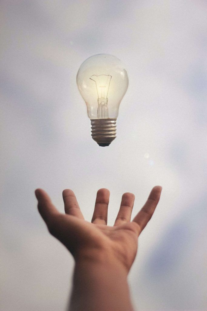 Floating bulb above open hand
